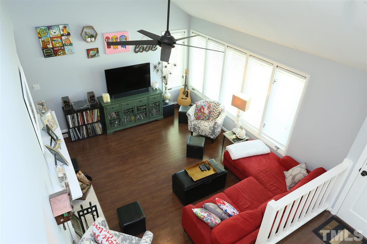 321 Bentpine Drive Raleigh, NC 27603 - Photo 24 of 30 a living room with furniture fireplace and a flat screen tv