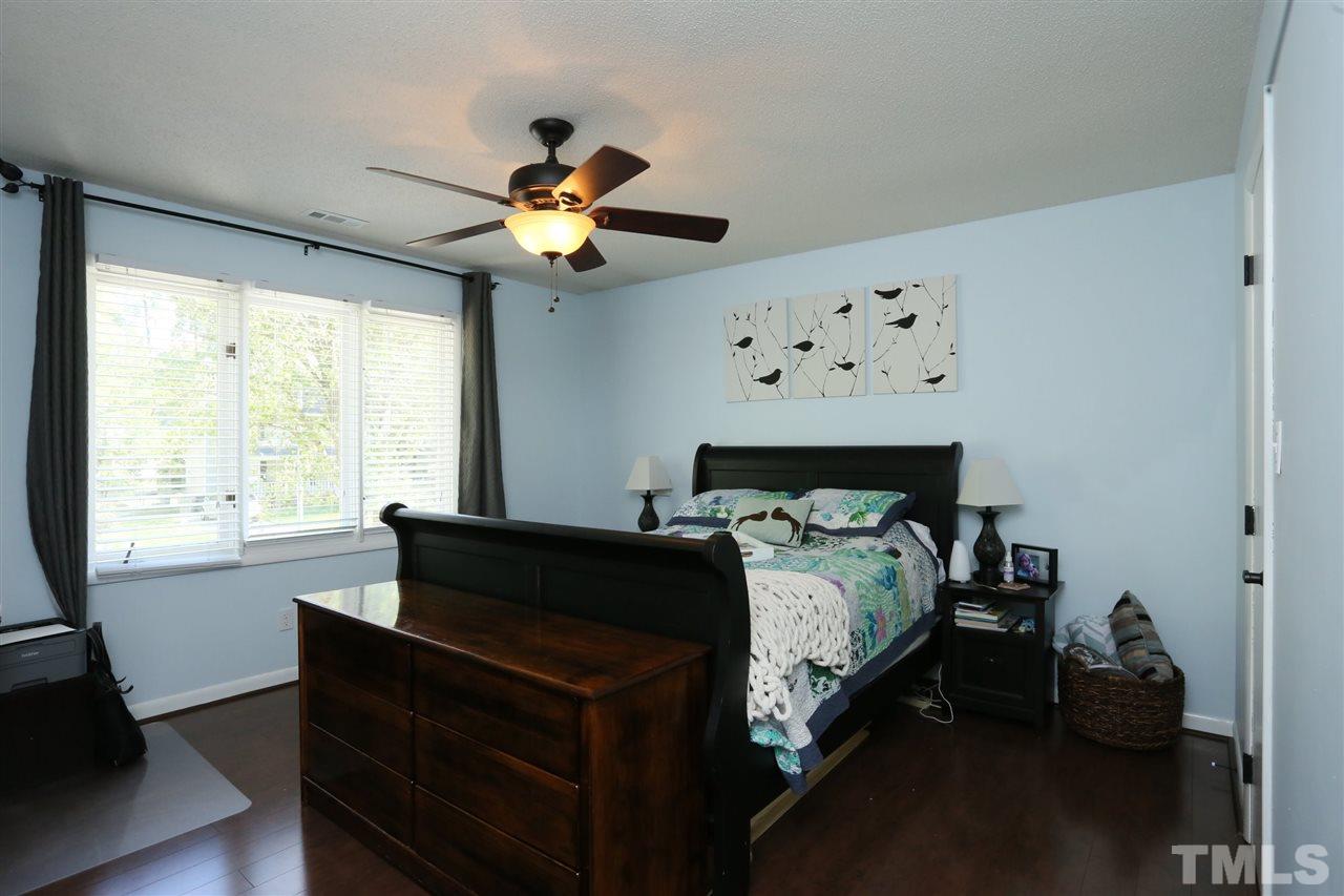 321 Bentpine Drive Raleigh, NC 27603 - Photo 25 of 30 a bed sitting in a bedroom next to a window