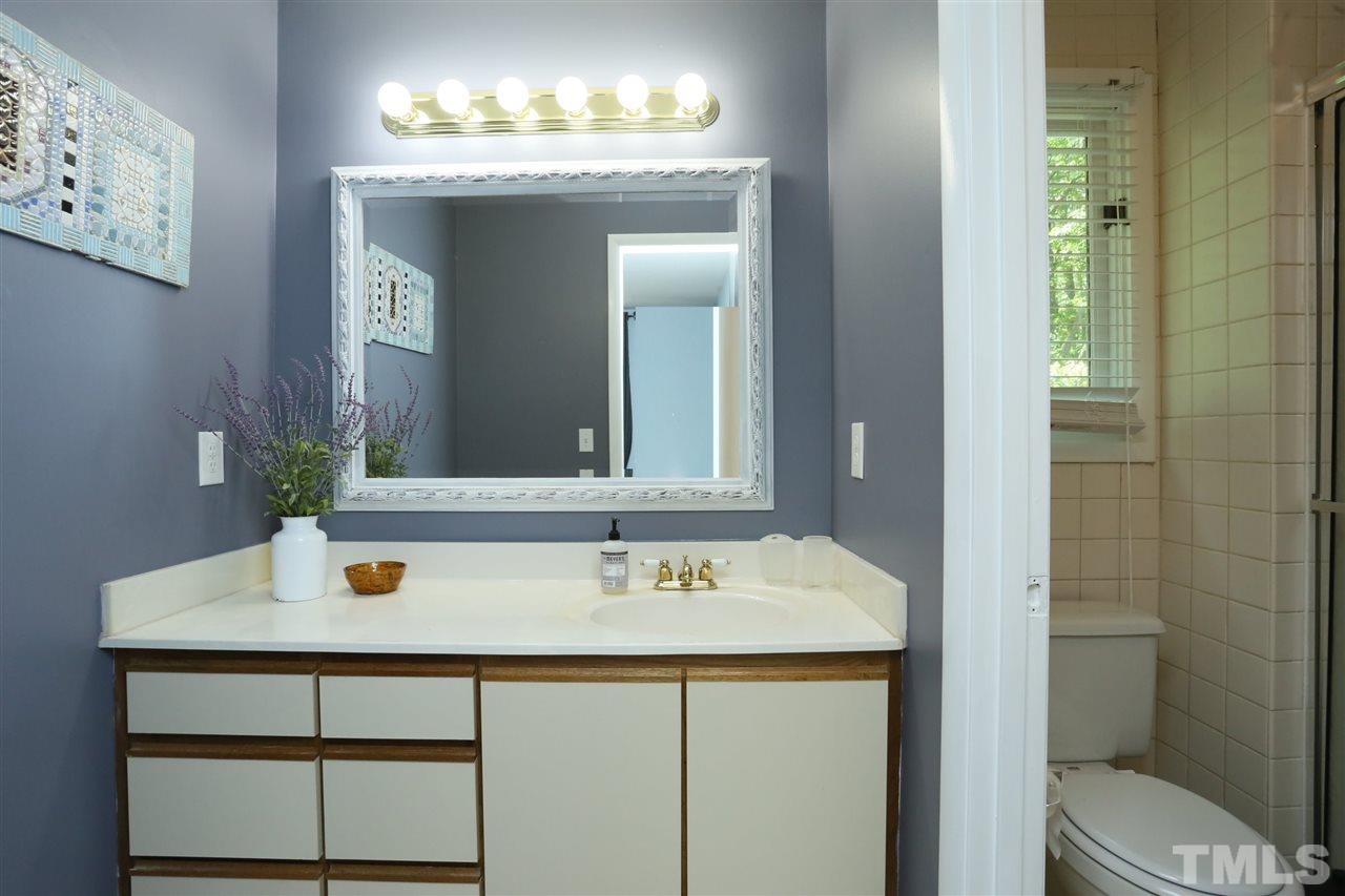 321 Bentpine Drive Raleigh, NC 27603 - Photo 26 of 30 a bathroom with a sink and a mirror