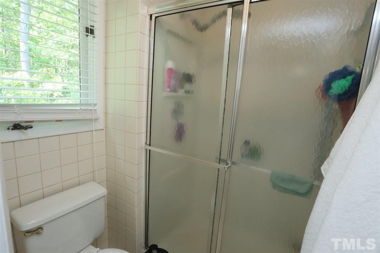 321 Bentpine Drive Raleigh, NC 27603 - Photo 27 of 30 a bathroom with a shower and toilet