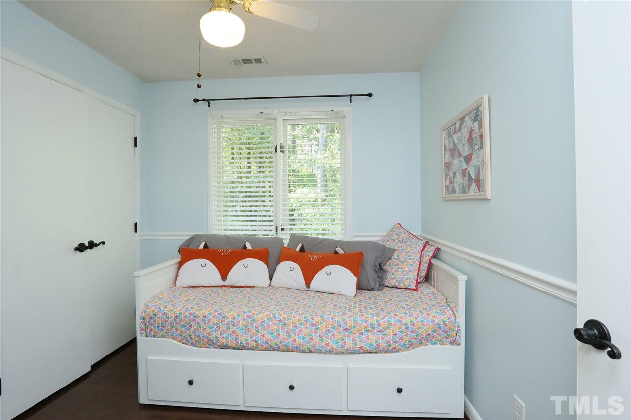 321 Bentpine Drive Raleigh, NC 27603 - Photo 29 of 30 a bed sitting in a bedroom next to a window