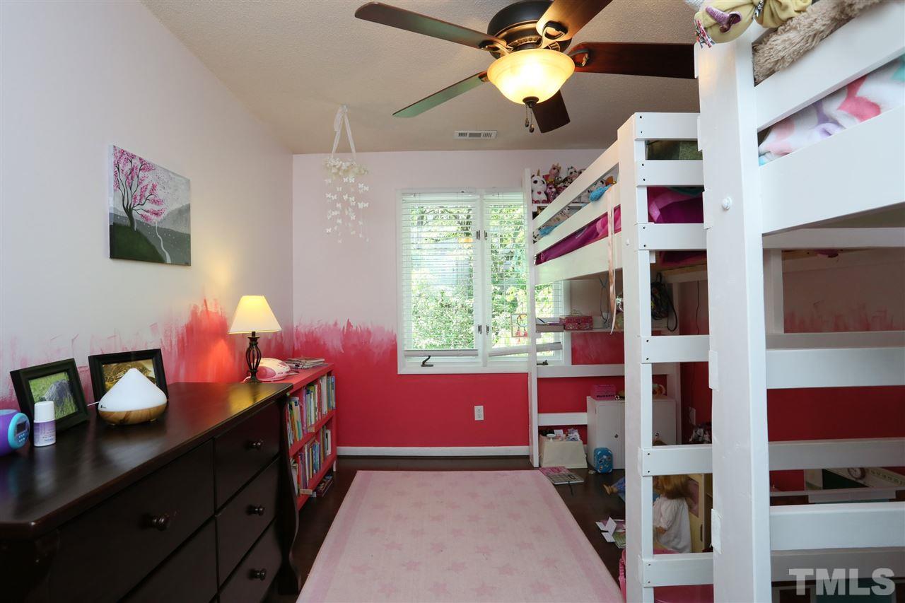 321 Bentpine Drive Raleigh, NC 27603 - Photo 30 of 30 a bedroom with a bed dresser and a window