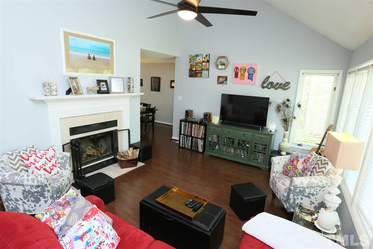 321 Bentpine Drive Raleigh, NC 27603 - Photo 8 of 30 a living room with furniture and a flat screen tv