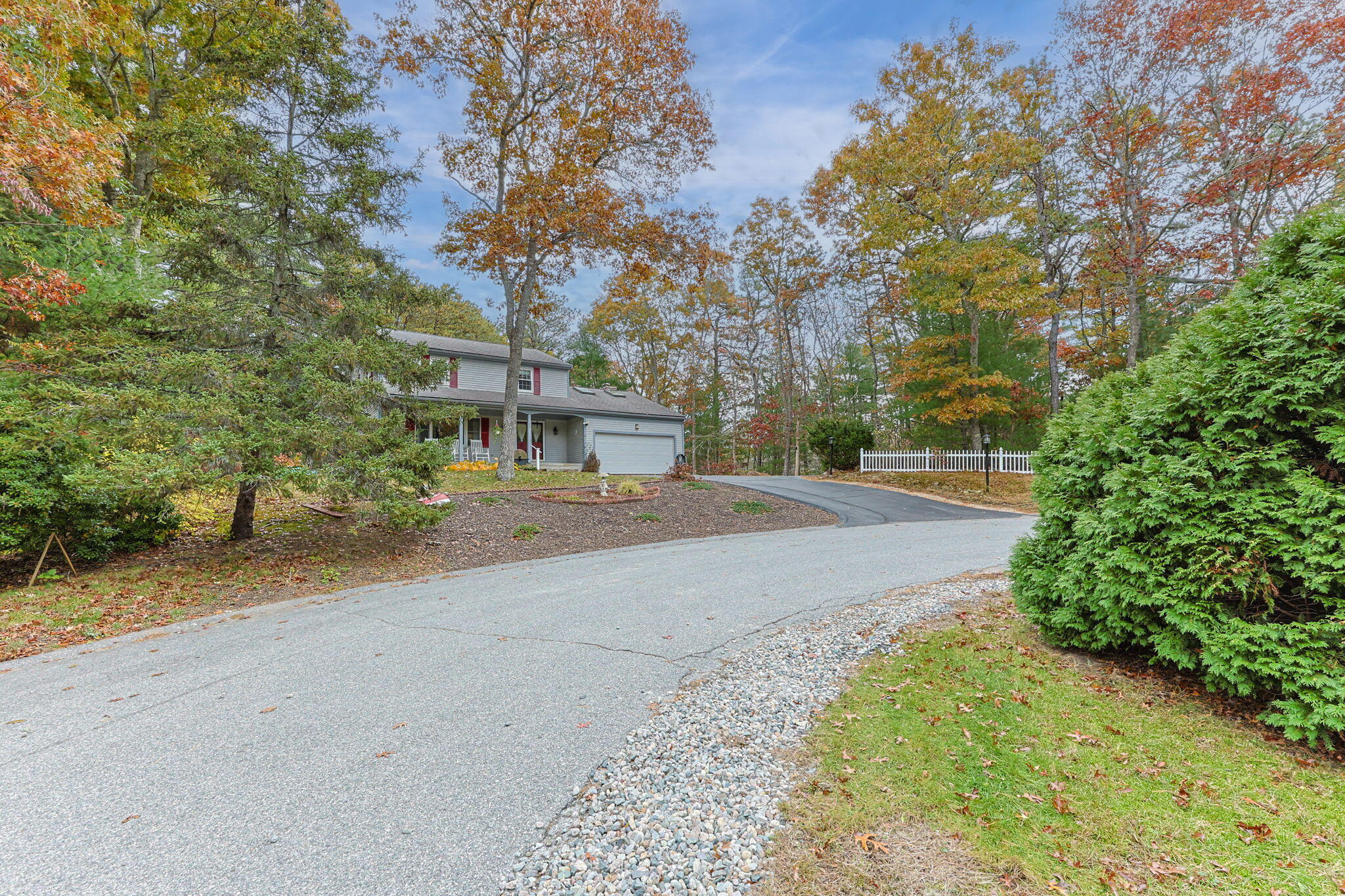12 Beachwood Road Bourne, MA 02532 - Photo 1 of 64 a view of road with large trees