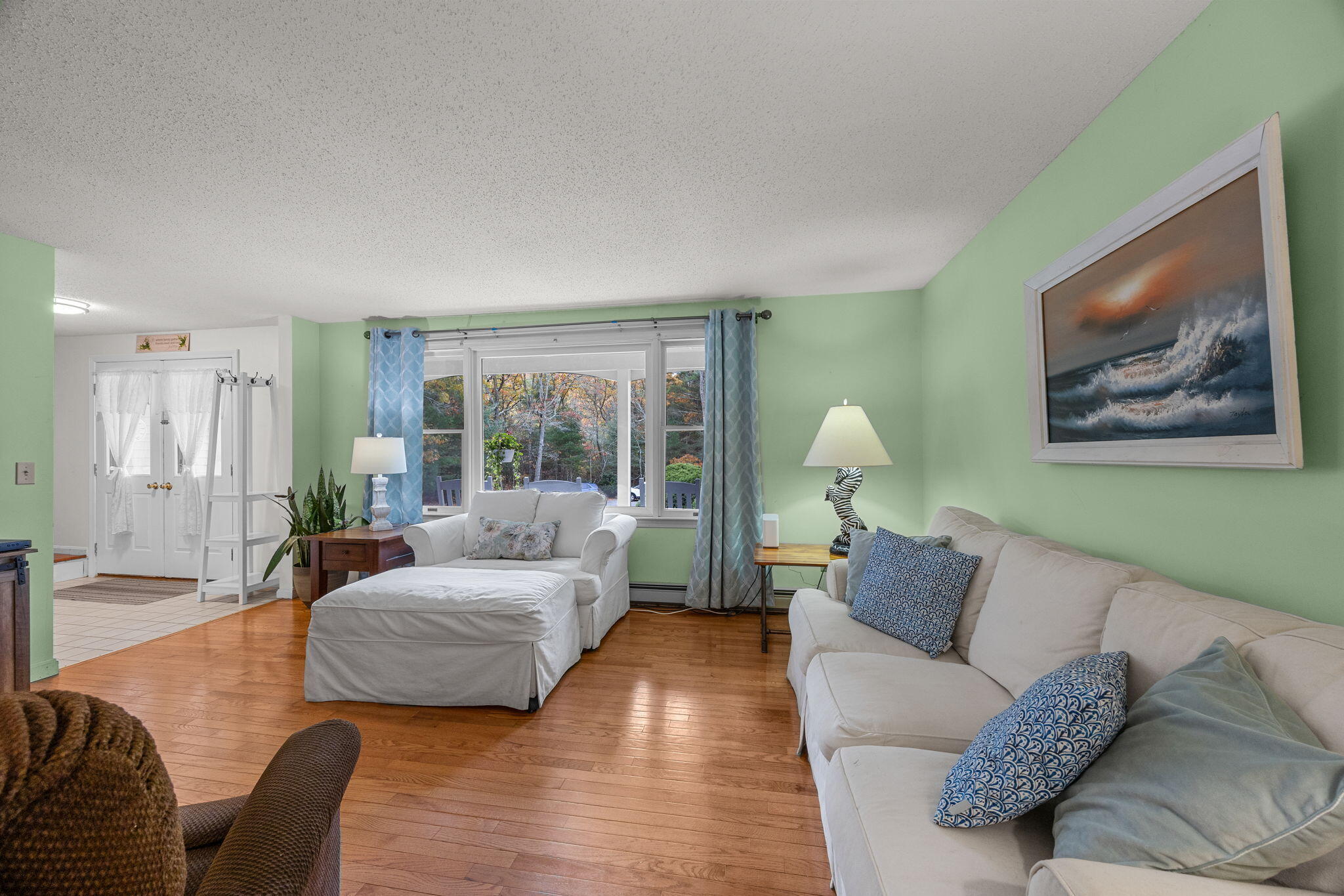 12 Beachwood Road Bourne, MA 02532 - Photo 12 of 64 a living room with furniture and a large window
