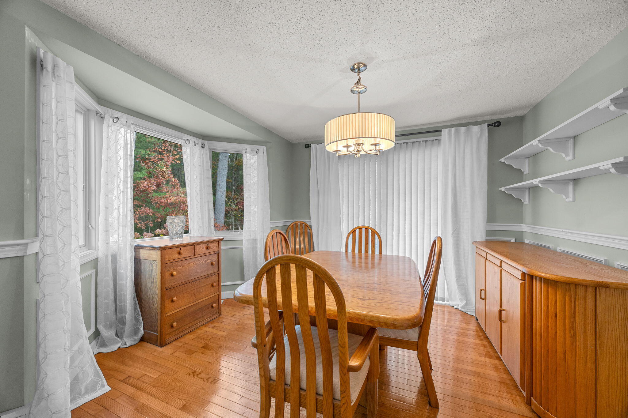 12 Beachwood Road Bourne, MA 02532 - Photo 13 of 64 a view of a dining room with furniture window and wooden floor
