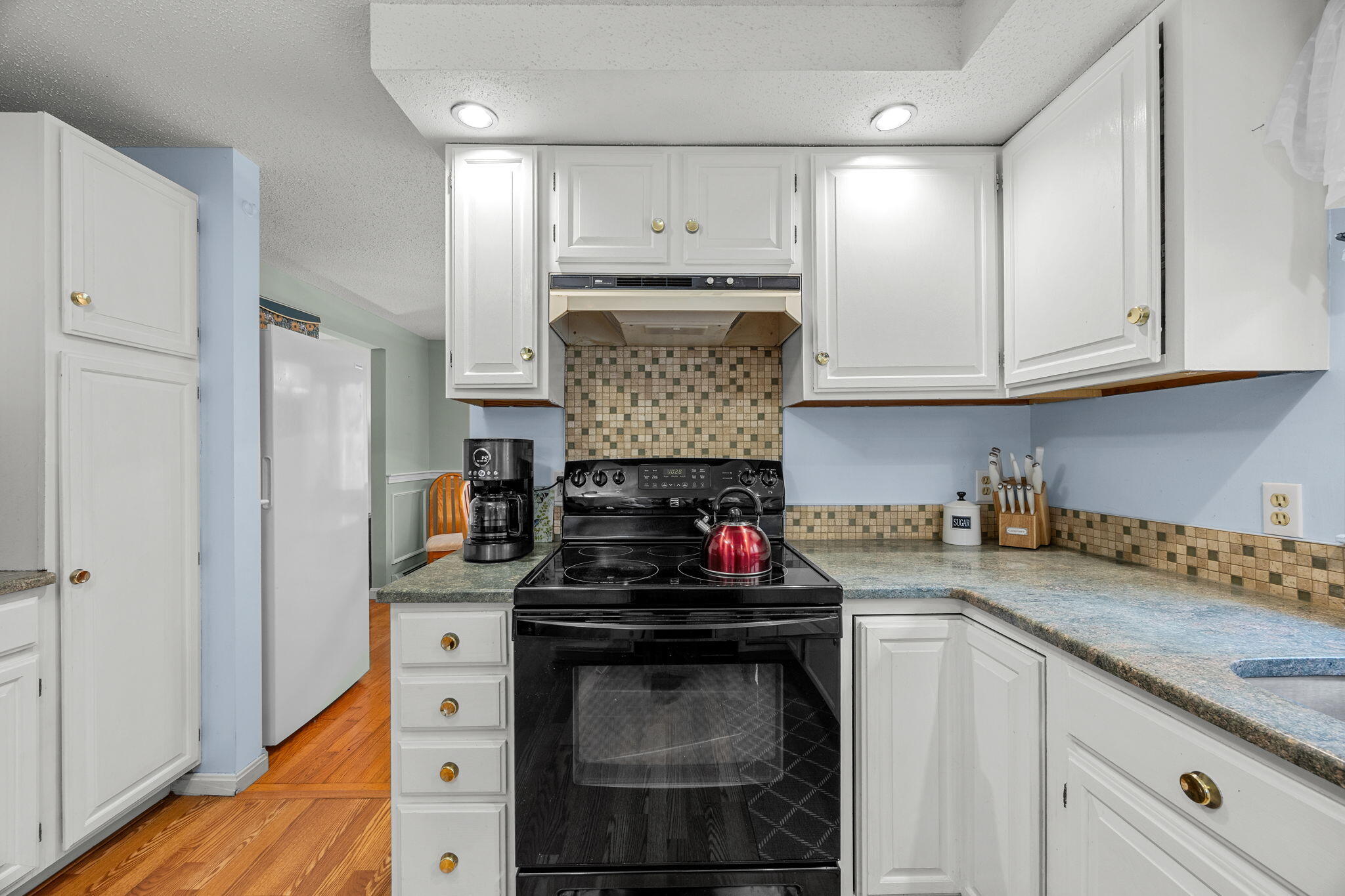 12 Beachwood Road Bourne, MA 02532 - Photo 19 of 64 a kitchen with stainless steel appliances granite countertop a stove and cabinets