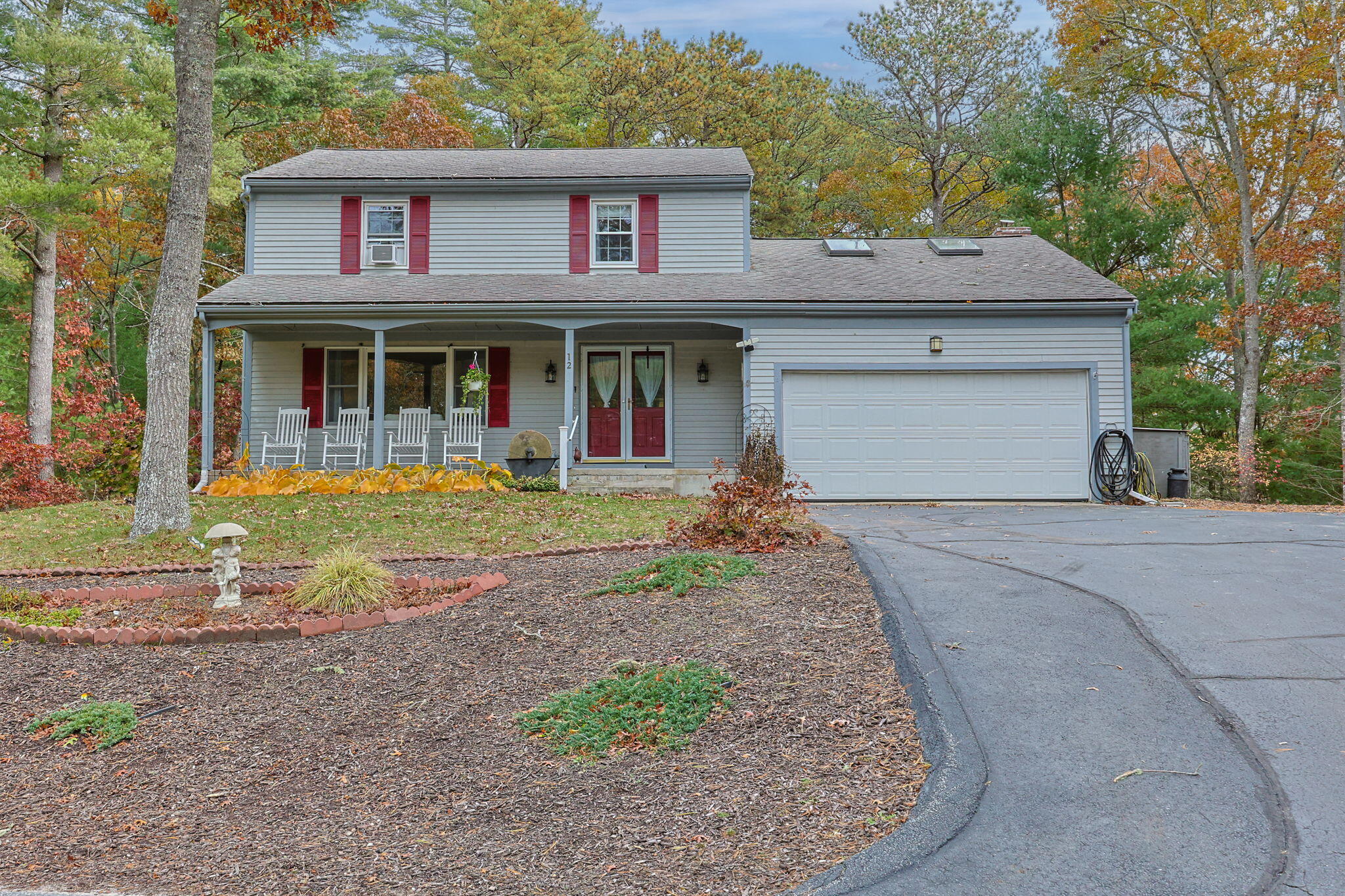 12 Beachwood Road Bourne, MA 02532 - Photo 2 of 64 a front view of a house with garden