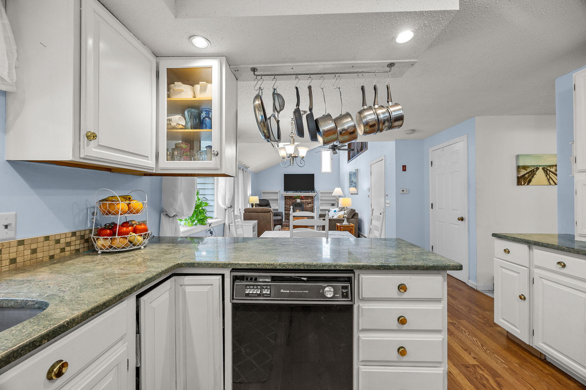 12 Beachwood Road Bourne, MA 02532 - Photo 21 of 64 a kitchen with stainless steel appliances granite countertop a sink stove and cabinets