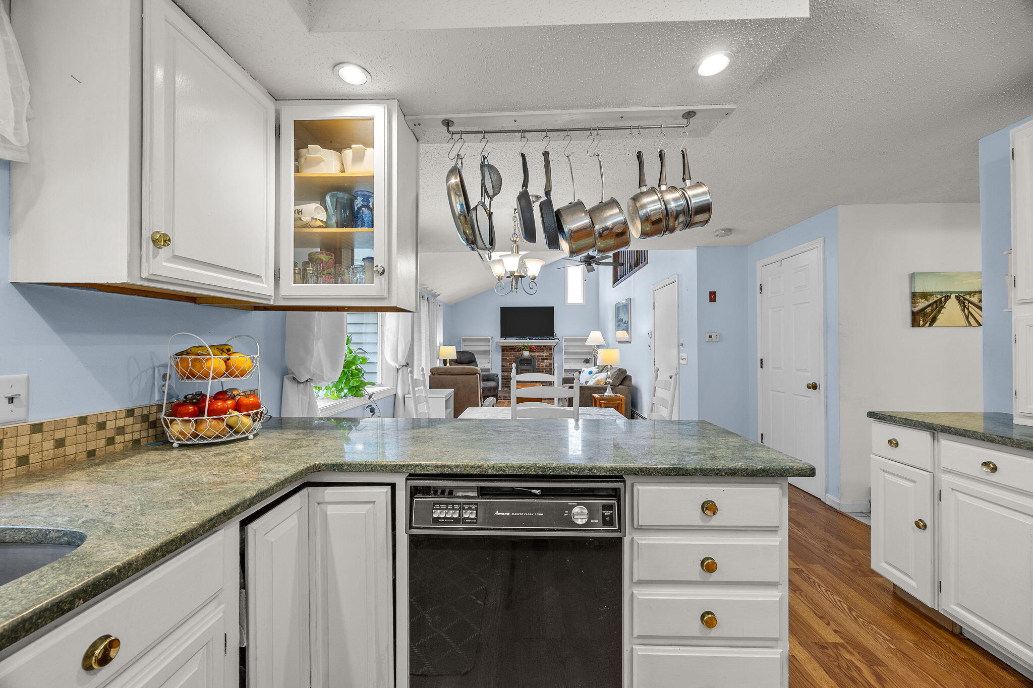12 Beachwood Road Bourne, MA 02532 - Photo 22 of 64 a kitchen with stainless steel appliances granite countertop a sink stove and cabinets