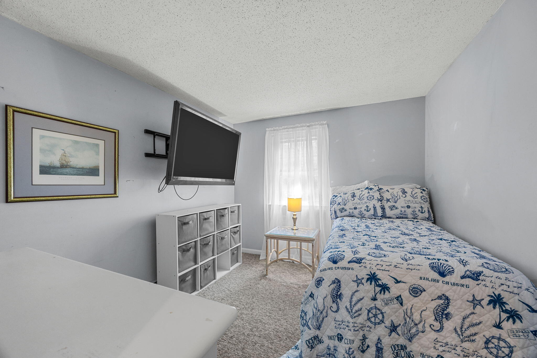 12 Beachwood Road Bourne, MA 02532 - Photo 28 of 64 a bedroom with a bed and a flat screen tv