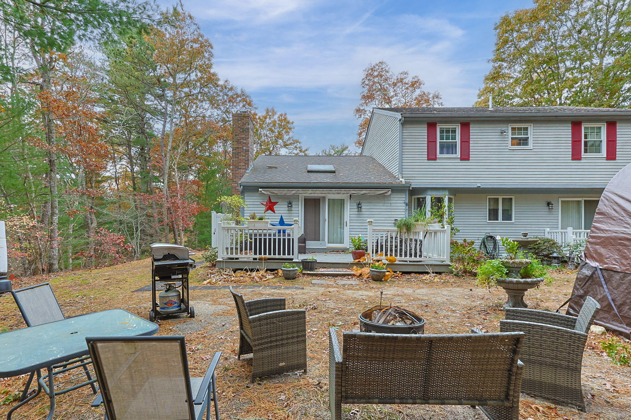 12 Beachwood Road Bourne, MA 02532 - Photo 40 of 64 a patio with a table and chairs