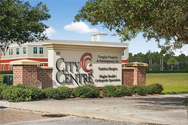 a view of a swimming pool and a yard