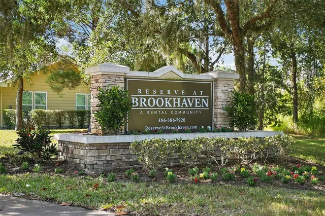 a view of a building with a yard