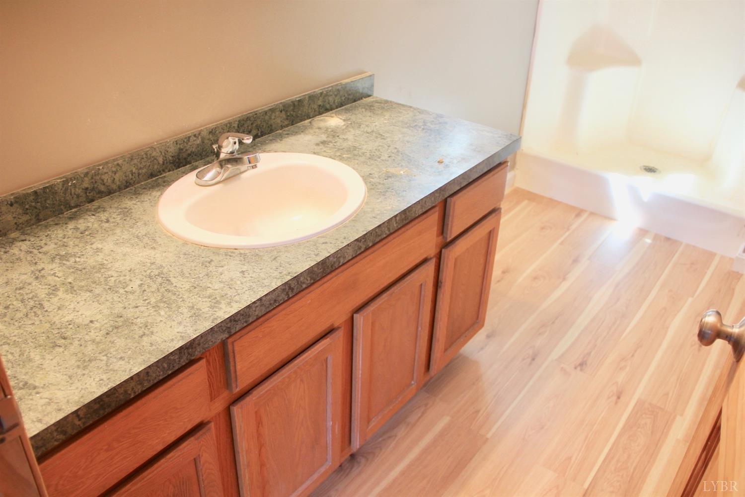 792 Fletchers Level Road Amherst, VA 24521 - Photo 17 of 40 a bathroom with a sink and a mirror