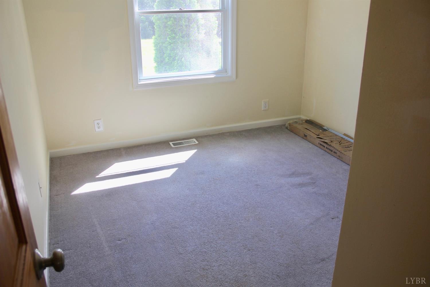 792 Fletchers Level Road Amherst, VA 24521 - Photo 22 of 40 an empty room with a window