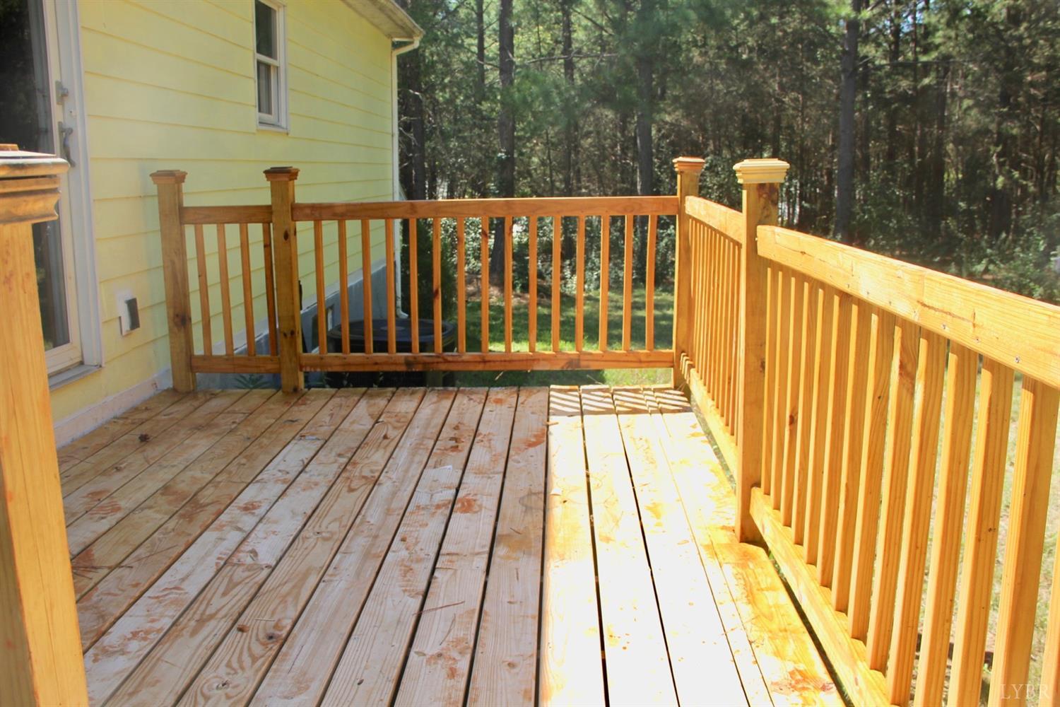 792 Fletchers Level Road Amherst, VA 24521 - Photo 26 of 40 a view of wooden balcony with a floor to ceiling window