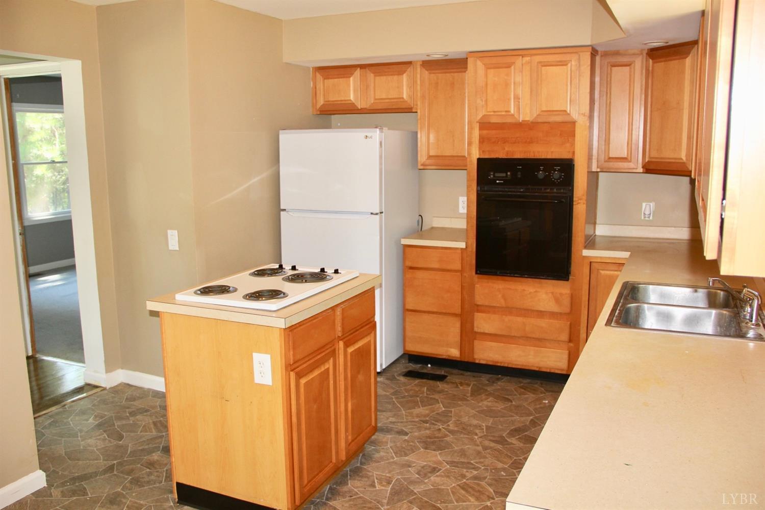 792 Fletchers Level Road Amherst, VA 24521 - Photo 8 of 40 a kitchen with stainless steel appliances granite countertop a stove a refrigerator and a cabinets