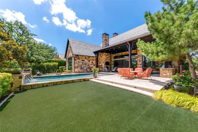 a view of a patio with swimming pool table and chairs