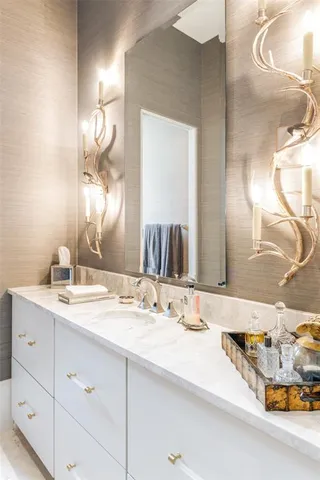 a bathroom with a sink double vanity and a mirror
