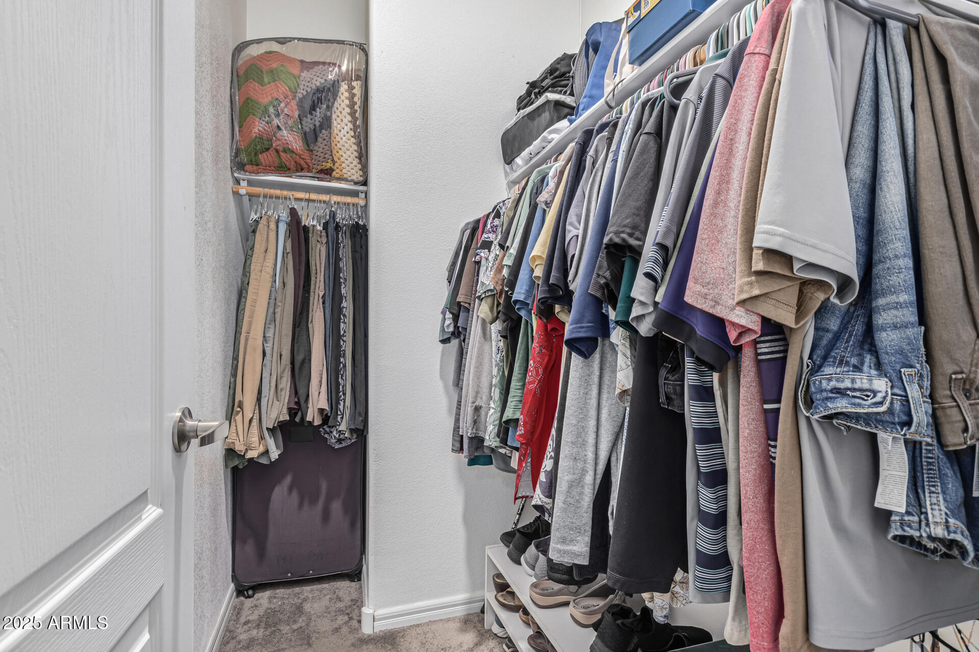 650 North Hawes Road, Unit 3815 Mesa, AZ 85207 - Photo 20 of 29 a view of walk in closet with clothes and shoes