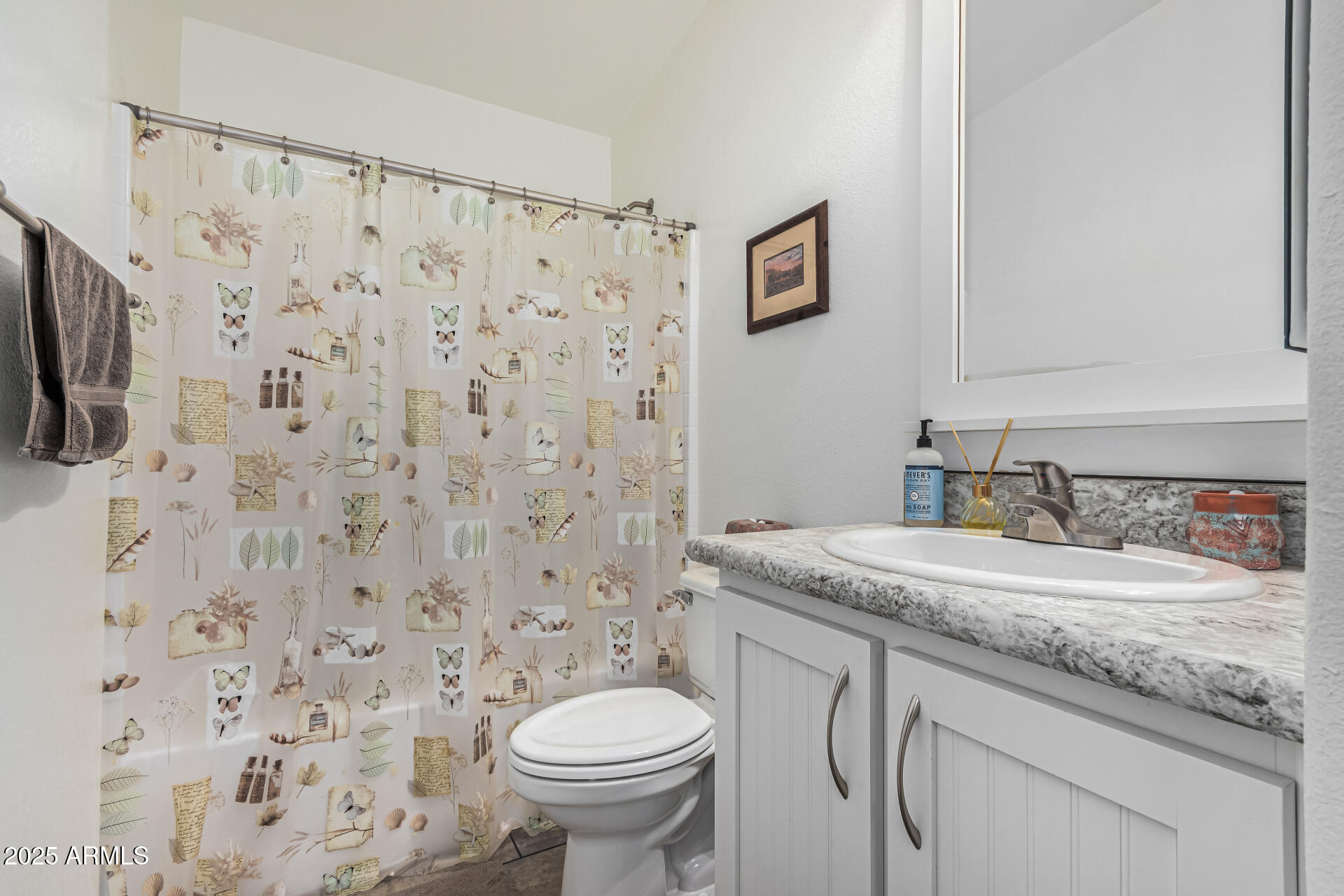 650 North Hawes Road, Unit 3815 Mesa, AZ 85207 - Photo 23 of 29 a bathroom with a granite countertop sink and a mirror