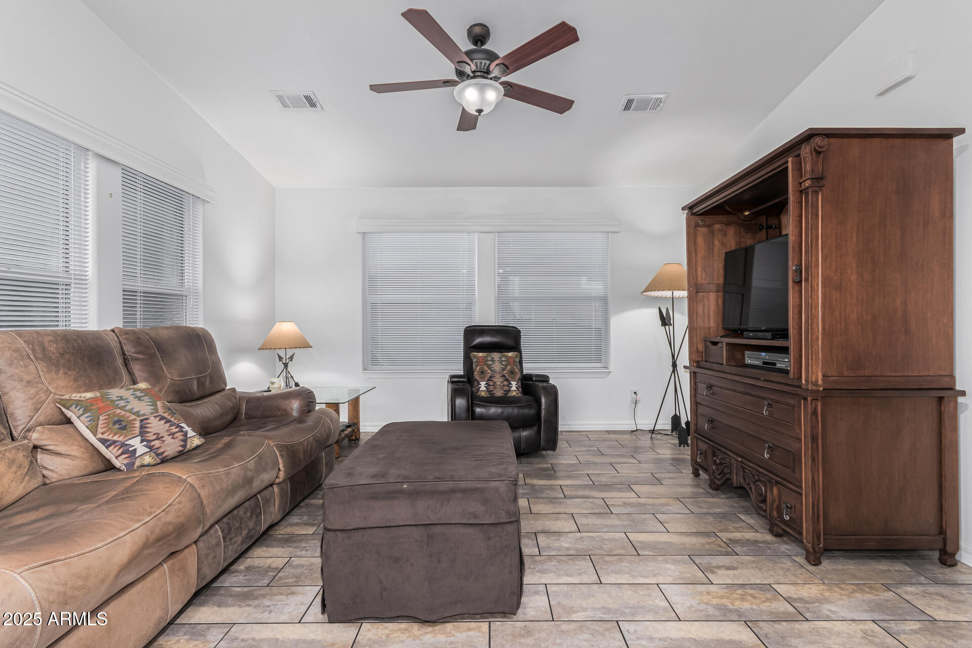 650 North Hawes Road, Unit 3815 Mesa, AZ 85207 - Photo 8 of 29 a living room with furniture and a refrigerator