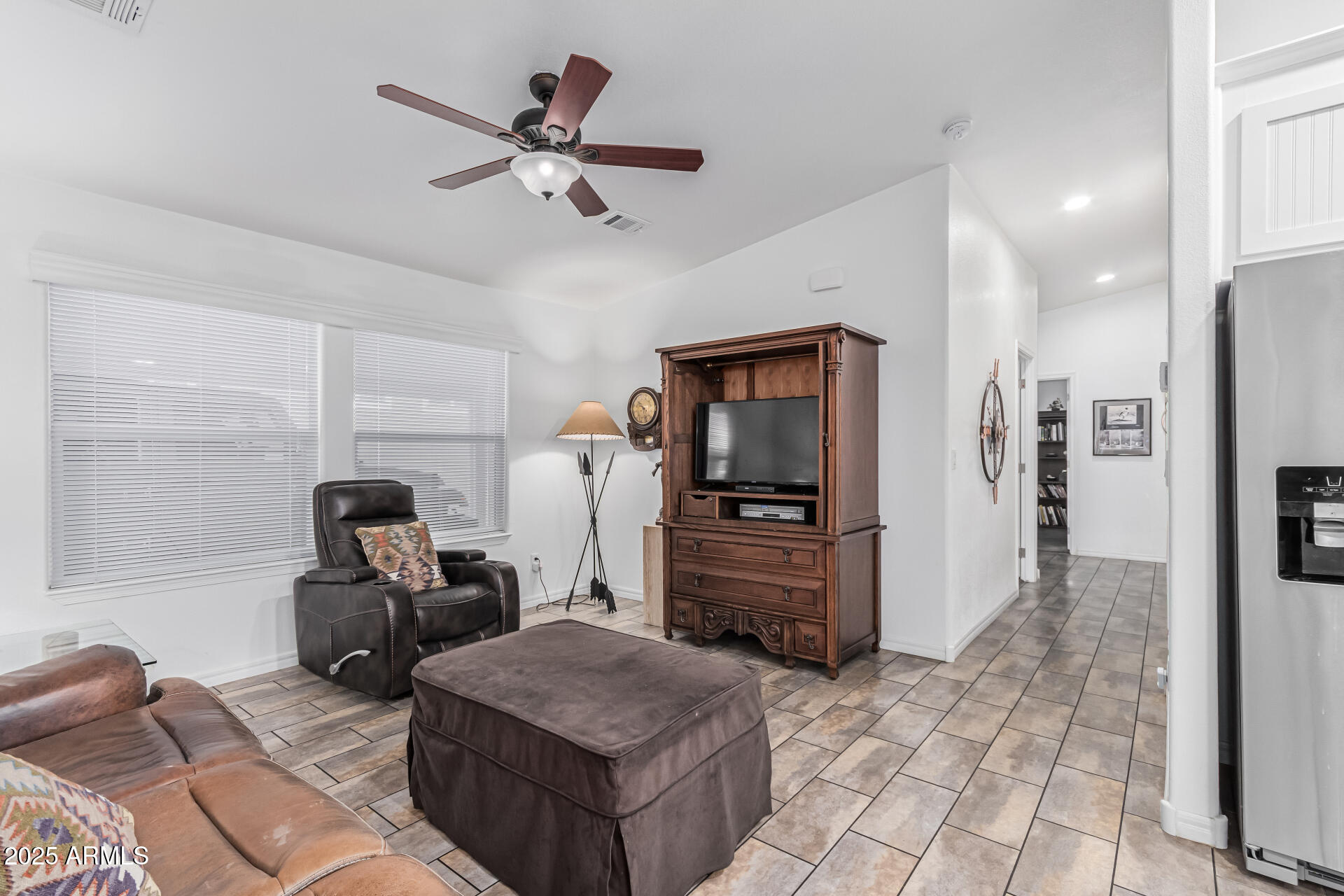 650 North Hawes Road, Unit 3815 Mesa, AZ 85207 - Photo 10 of 29 a room with furniture a ceiling fan and a rug