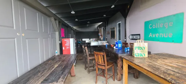 a dining room with furniture and a floor to ceiling window