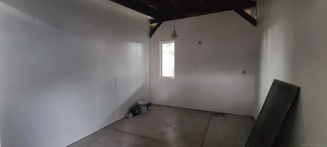 a view of swimming pool with seating space