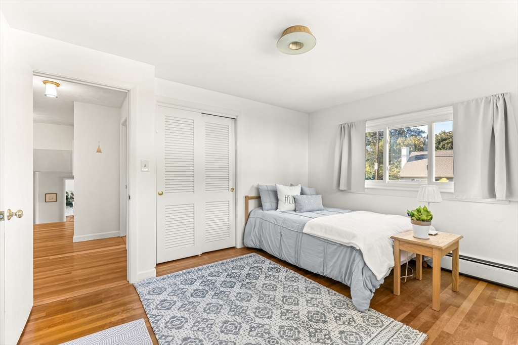 23 Cottonwood Road Wellesley, MA 02482 - Photo 11 of 19 a bedroom with a bed and a table in it