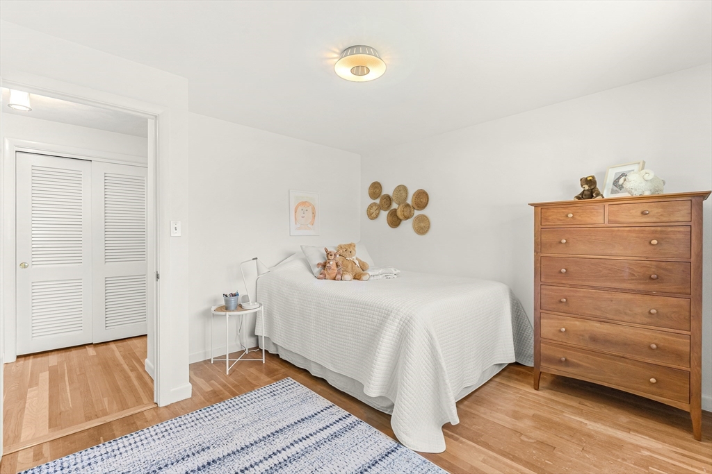 23 Cottonwood Road Wellesley, MA 02482 - Photo 13 of 19 a bedroom with a bed and cabinet