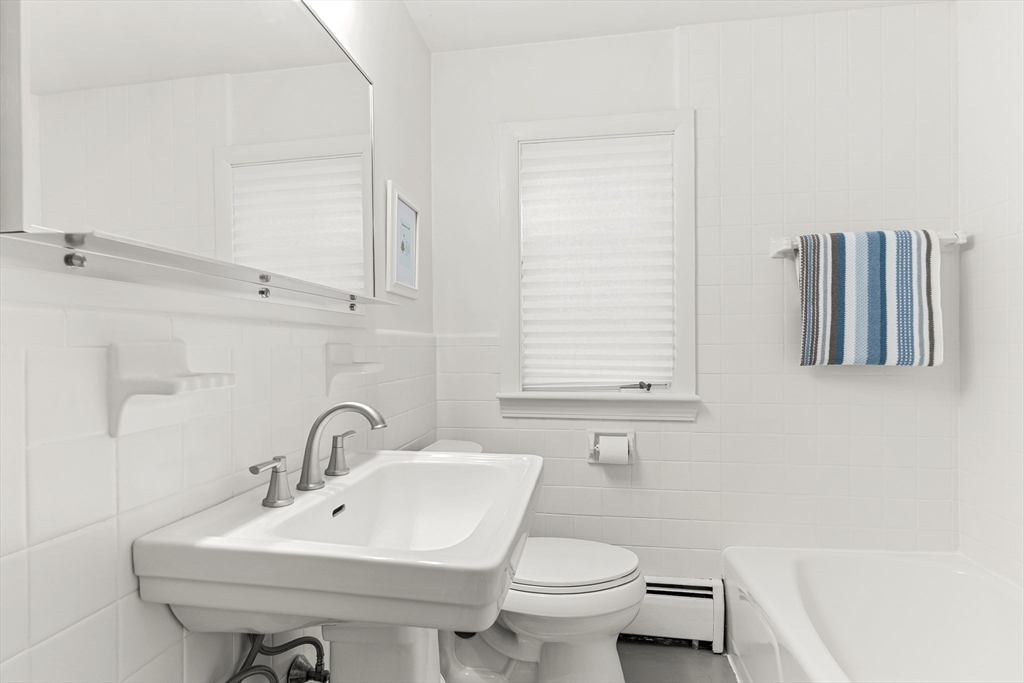 23 Cottonwood Road Wellesley, MA 02482 - Photo 14 of 19 a bathroom with a sink toilet and a mirror