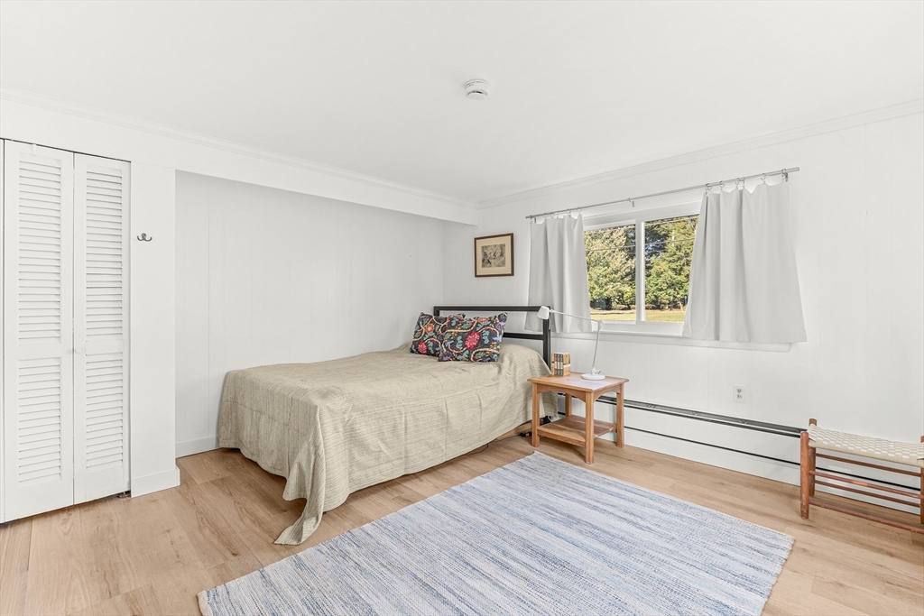 23 Cottonwood Road Wellesley, MA 02482 - Photo 15 of 19 a bedroom with a bed and wooden floor