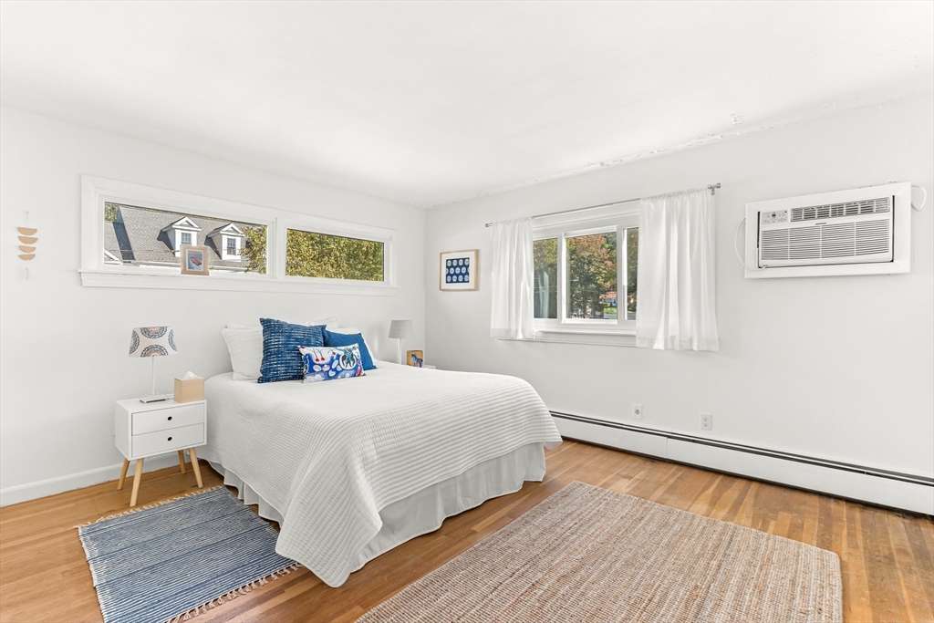 23 Cottonwood Road Wellesley, MA 02482 - Photo 9 of 19 a bedroom with a bed and wooden floor