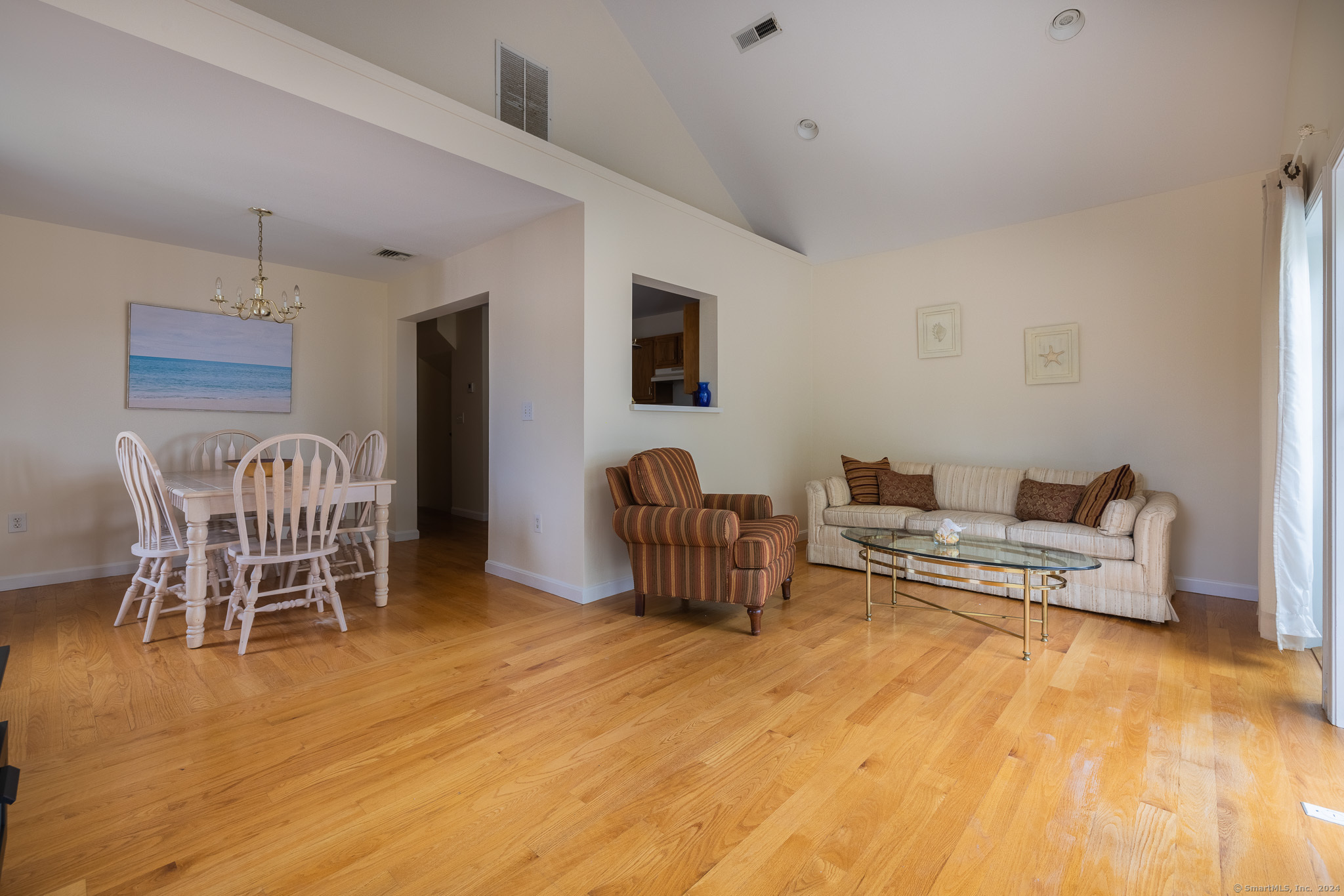 916 Reef Road Fairfield, CT 06824 - Photo 5 of 16 a living room with furniture and a flat screen tv