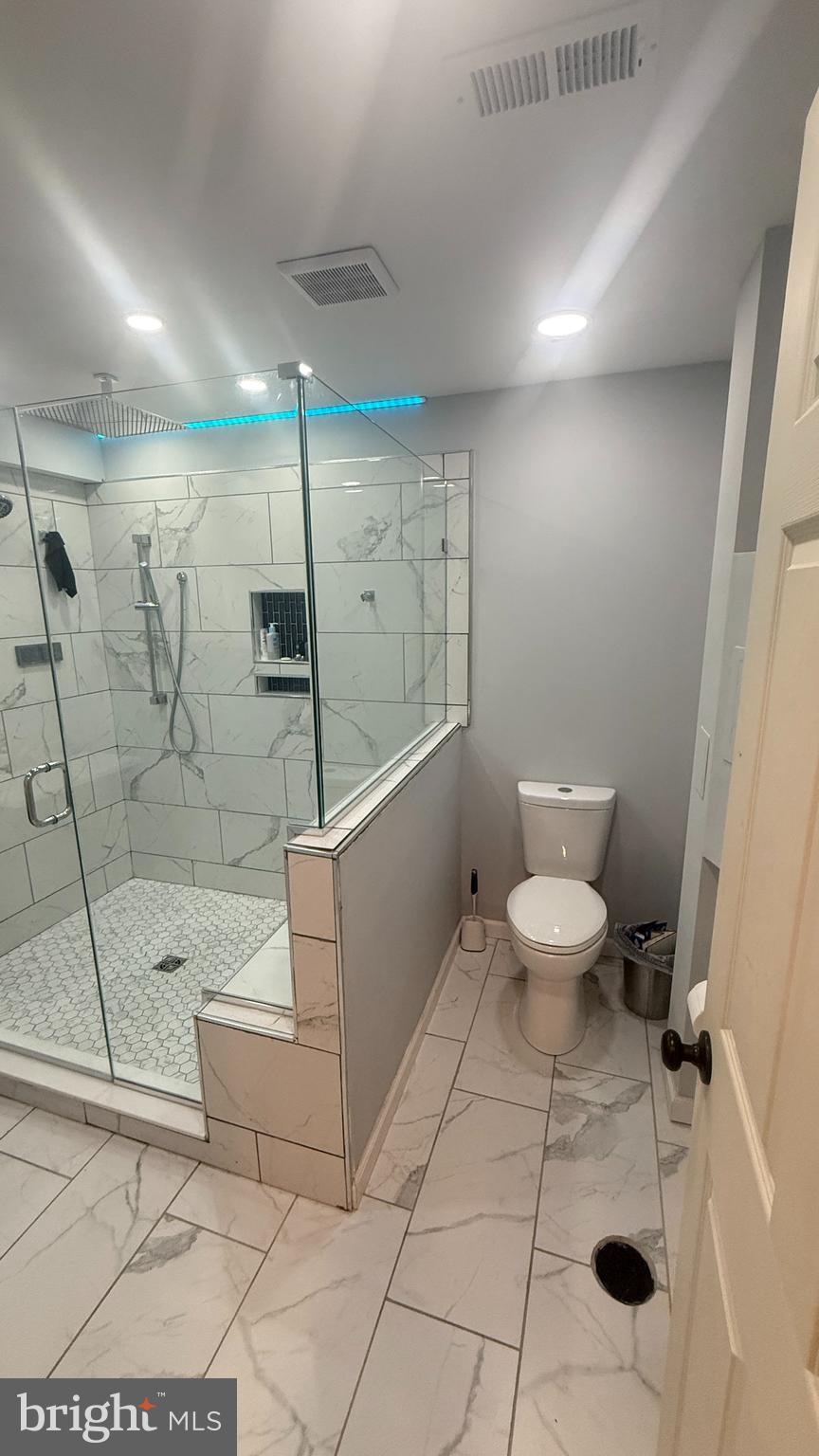 11 Hunters Forge Court Owings Mills, MD 21117 - Photo 110 of 139 a bathroom with a toilet a sink and a shower