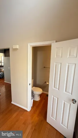 a kitchen with stainless steel appliances granite countertop sink refrigerator dining table and chairs