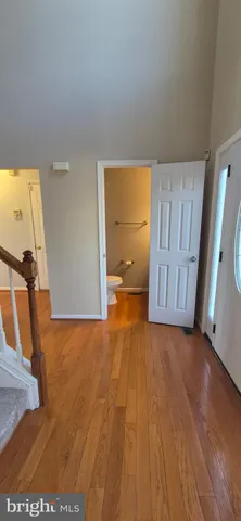 a kitchen with stainless steel appliances granite countertop a refrigerator and a table