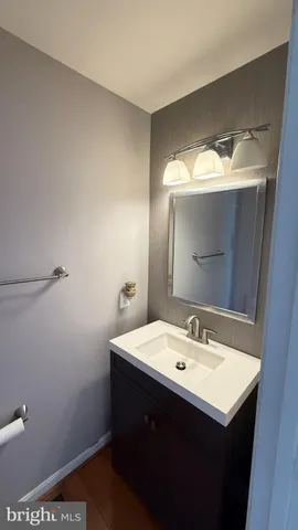 a view of a dining room with furniture and a chandelier