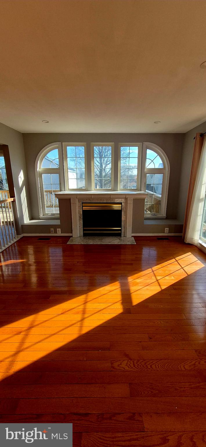 11 Hunters Forge Court Owings Mills, MD 21117 - Photo 40 of 139 a view of an empty room with window and wooden floor