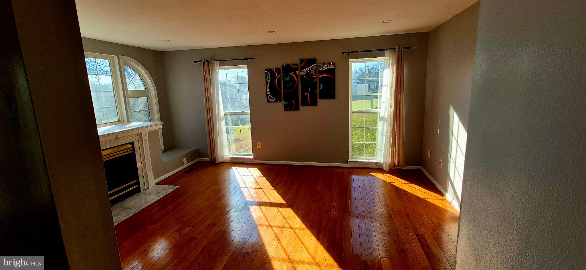 11 Hunters Forge Court Owings Mills, MD 21117 - Photo 41 of 139 a view of a hallway with wooden floor and windows