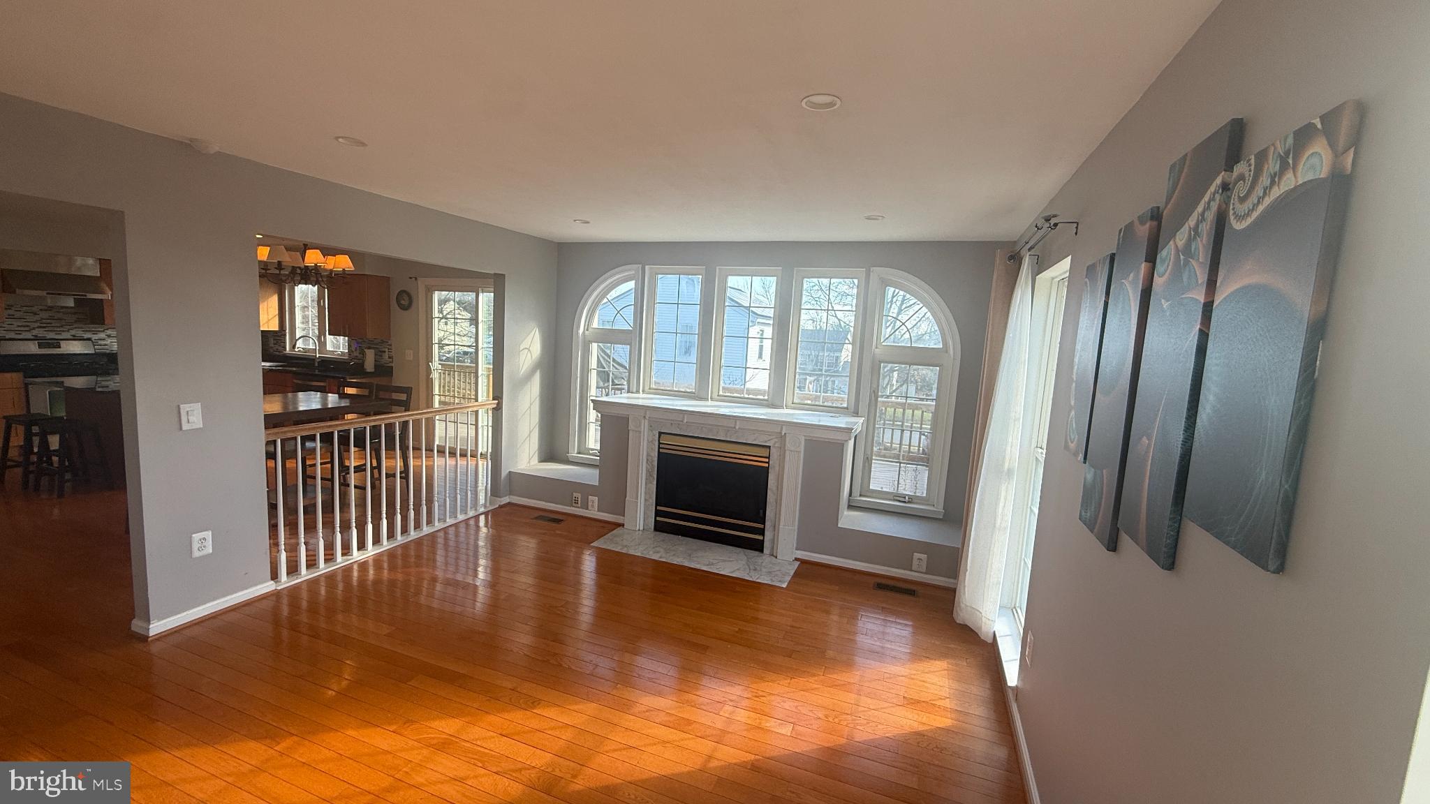 11 Hunters Forge Court Owings Mills, MD 21117 - Photo 47 of 139 a view of a livingroom with wooden floor fireplace and windows