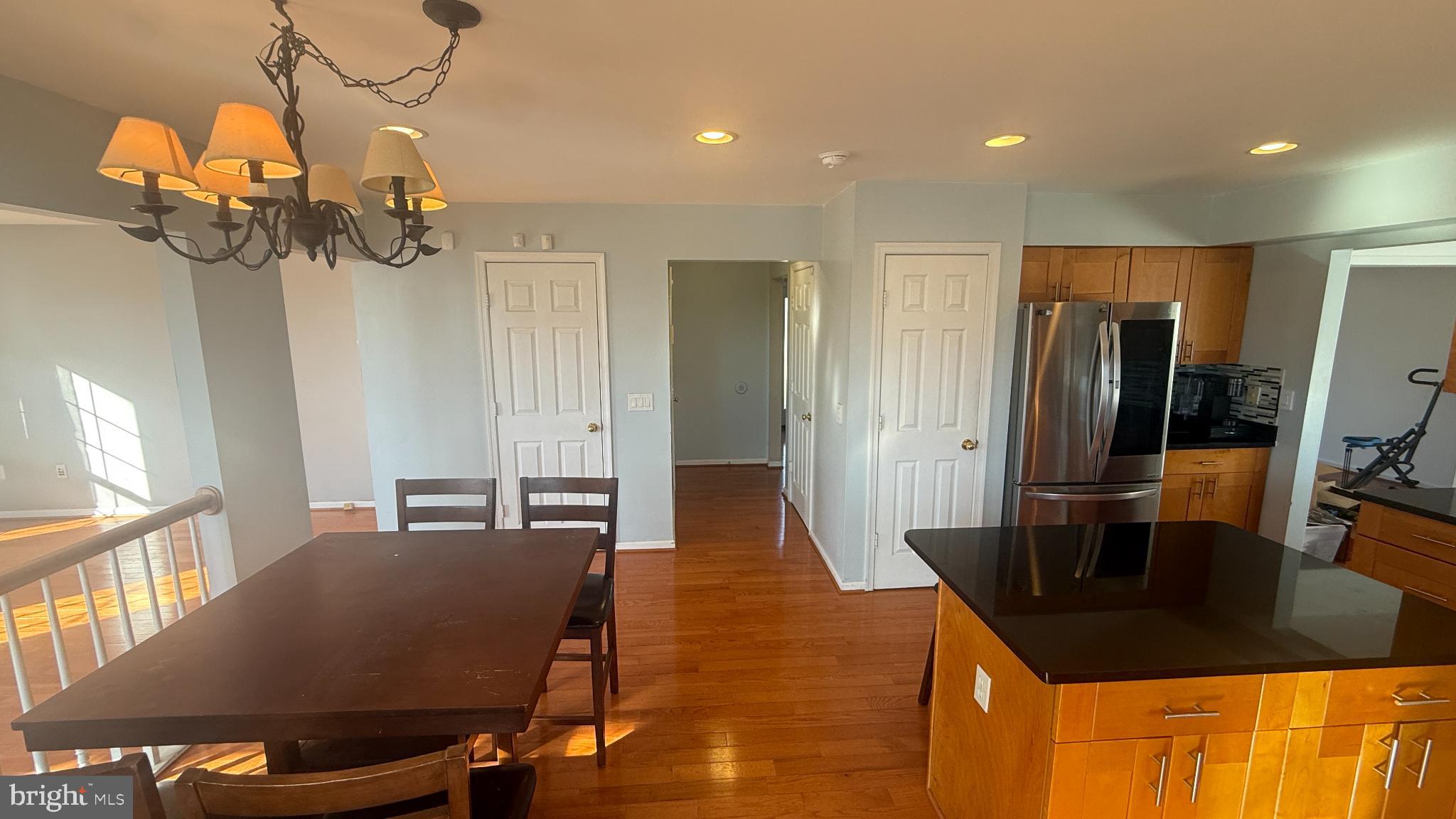 11 Hunters Forge Court Owings Mills, MD 21117 - Photo 62 of 139 a dining room filled chandelier and wooden floor
