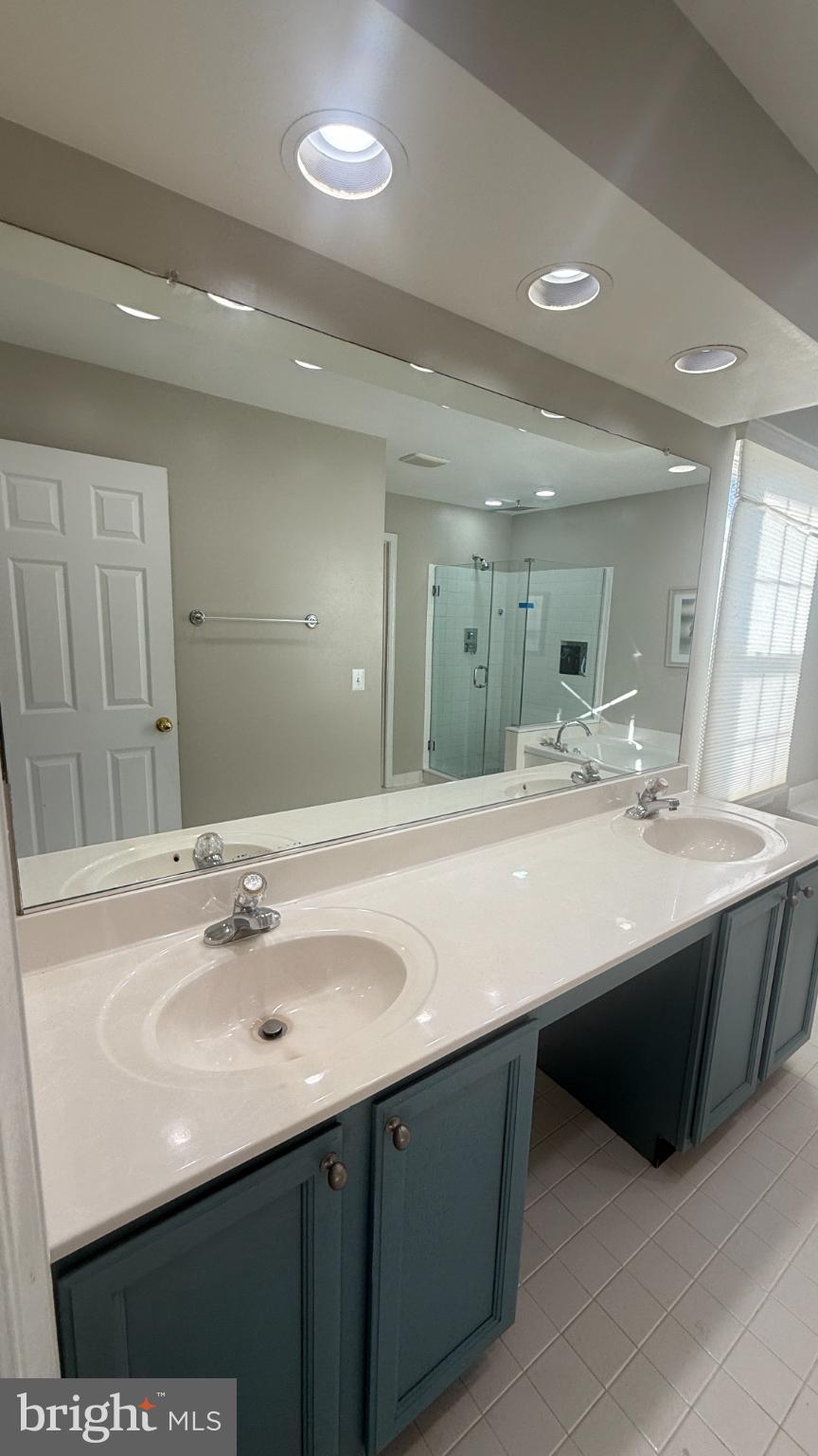 11 Hunters Forge Court Owings Mills, MD 21117 - Photo 74 of 139 a bathroom with a sink double vanity and a mirror