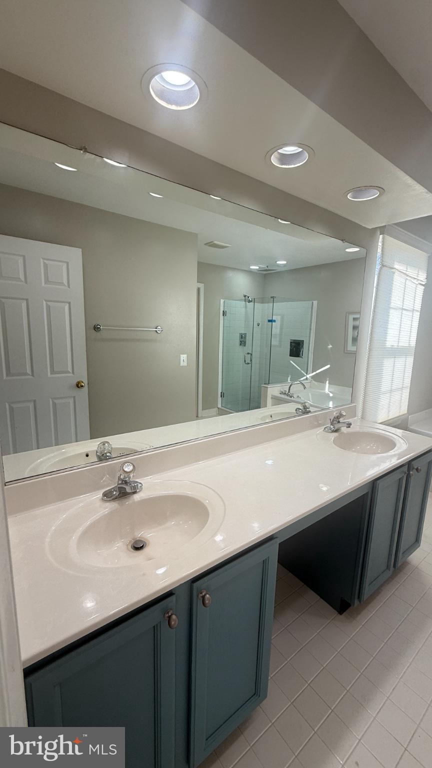 11 Hunters Forge Court Owings Mills, MD 21117 - Photo 76 of 139 a bathroom with a sink double vanity and a mirror