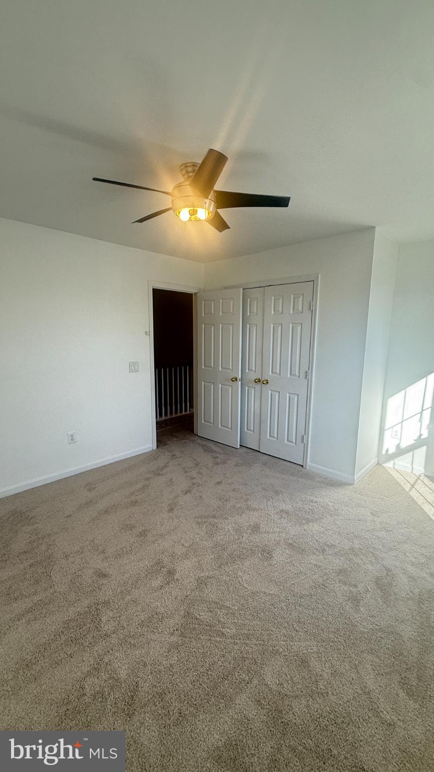 11 Hunters Forge Court Owings Mills, MD 21117 - Photo 91 of 139 a view of an empty room and chandelier fan