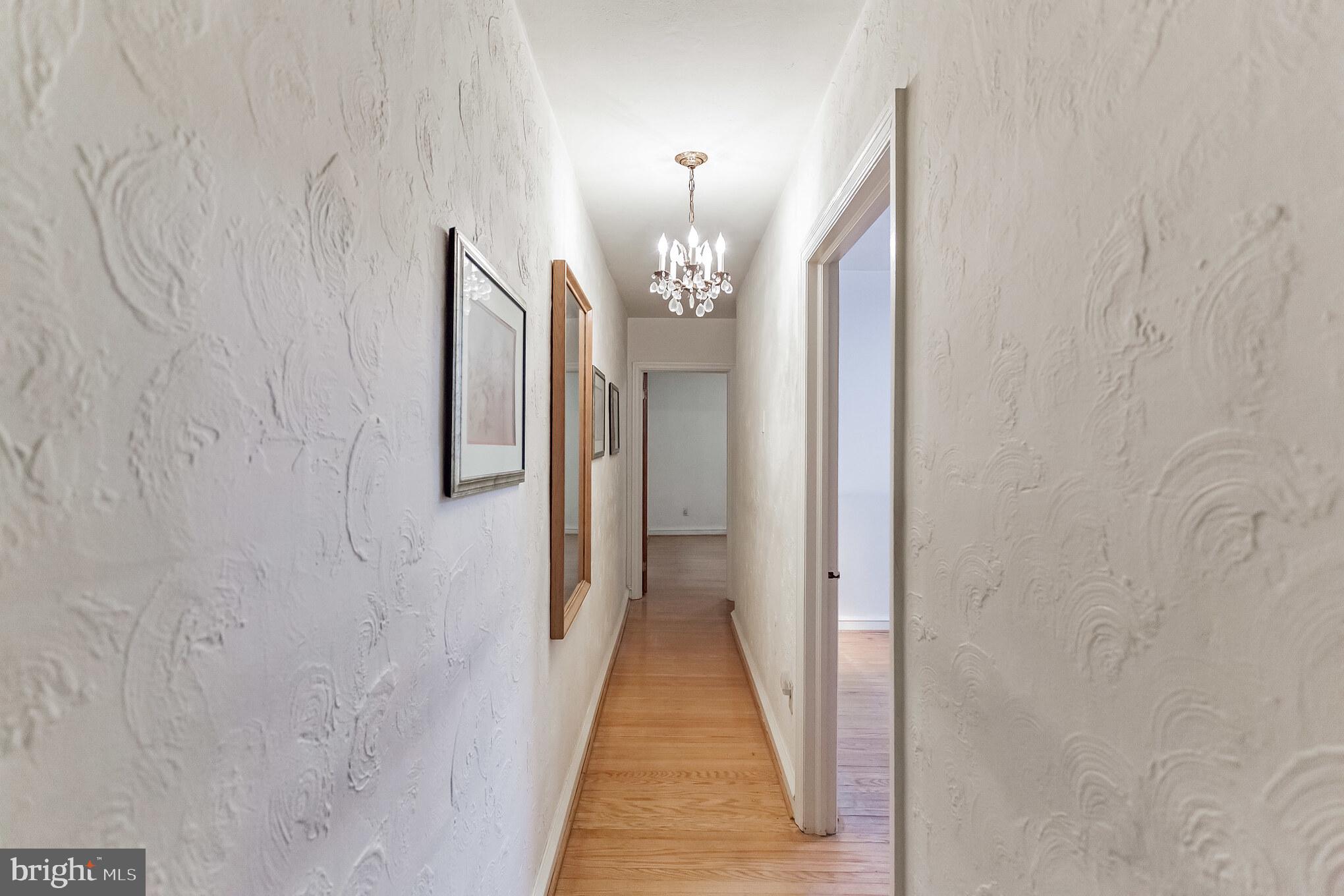 513 Pine Street Philadelphia, PA 19106 - Photo 18 of 32 a view of a hallway with chandelier
