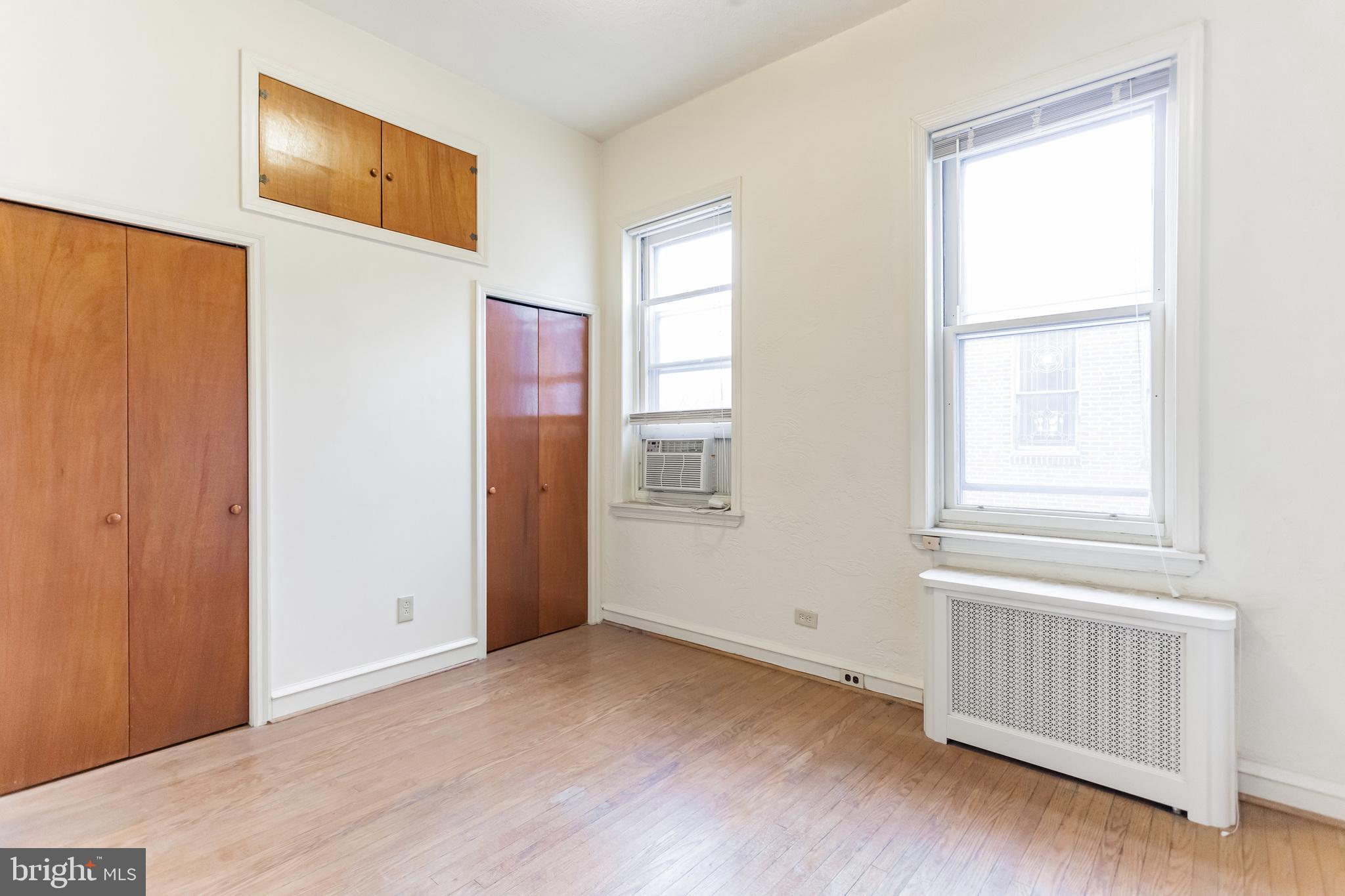 513 Pine Street Philadelphia, PA 19106 - Photo 25 of 32 a view of an empty room with wooden floor and a window