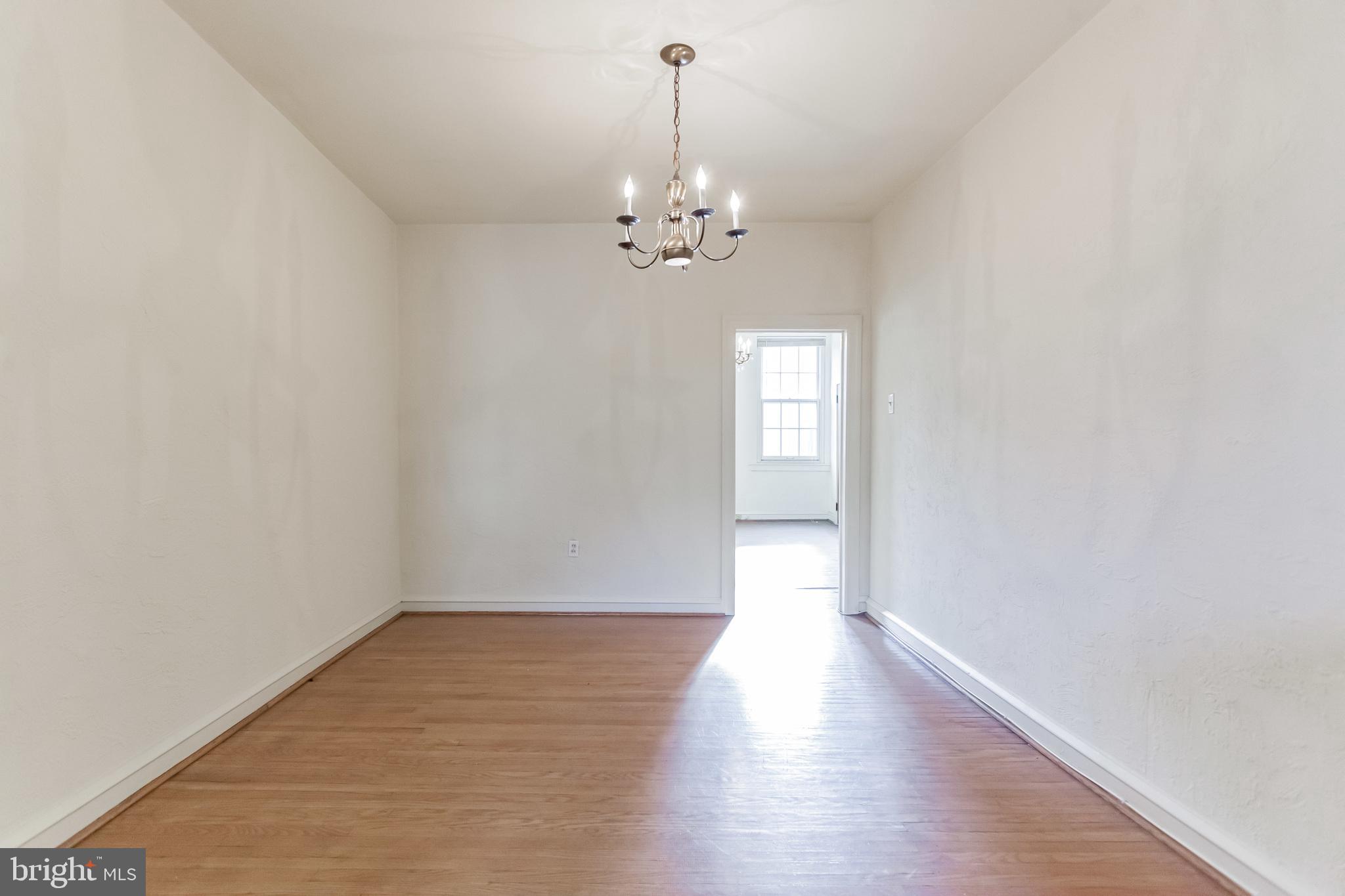 513 Pine Street Philadelphia, PA 19106 - Photo 26 of 32 wooden floor in an empty room with a window